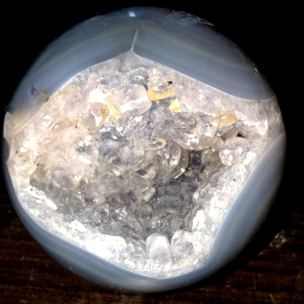Grey agate sphere with lots of druzy